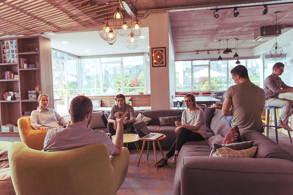Employee discussing cost of living in staff room