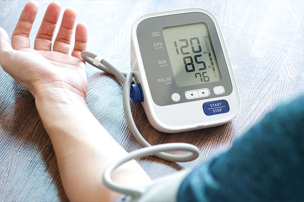 Employee checking blood pressure