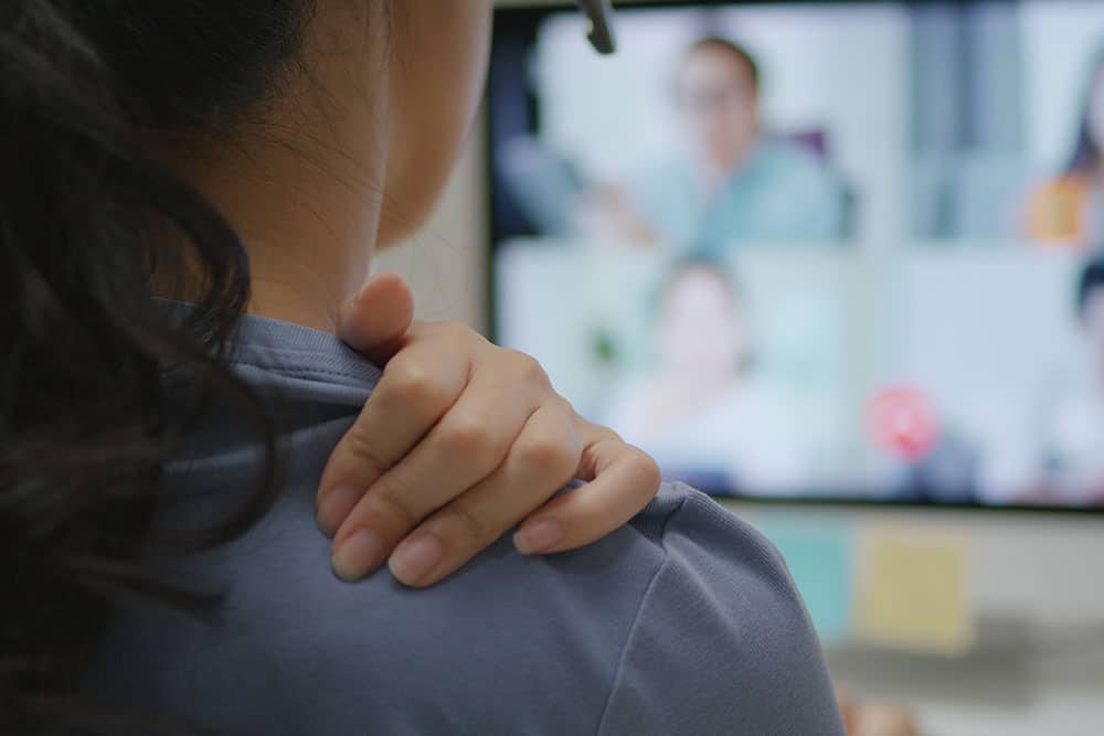 Employee with chronic pain at work